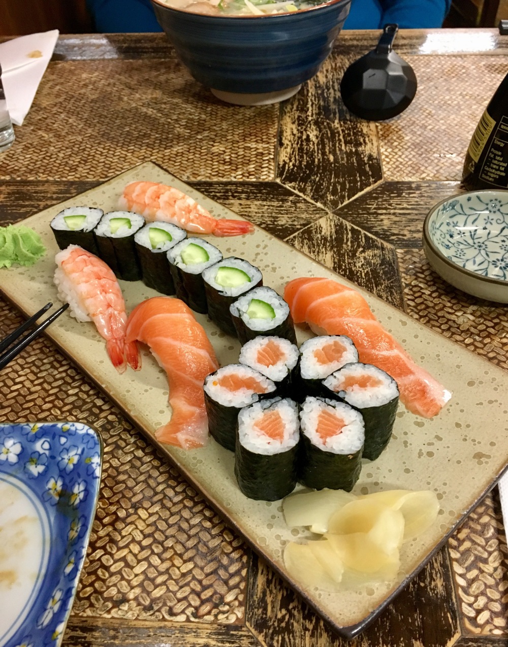 Picture of slices of sushi roll and sashimi